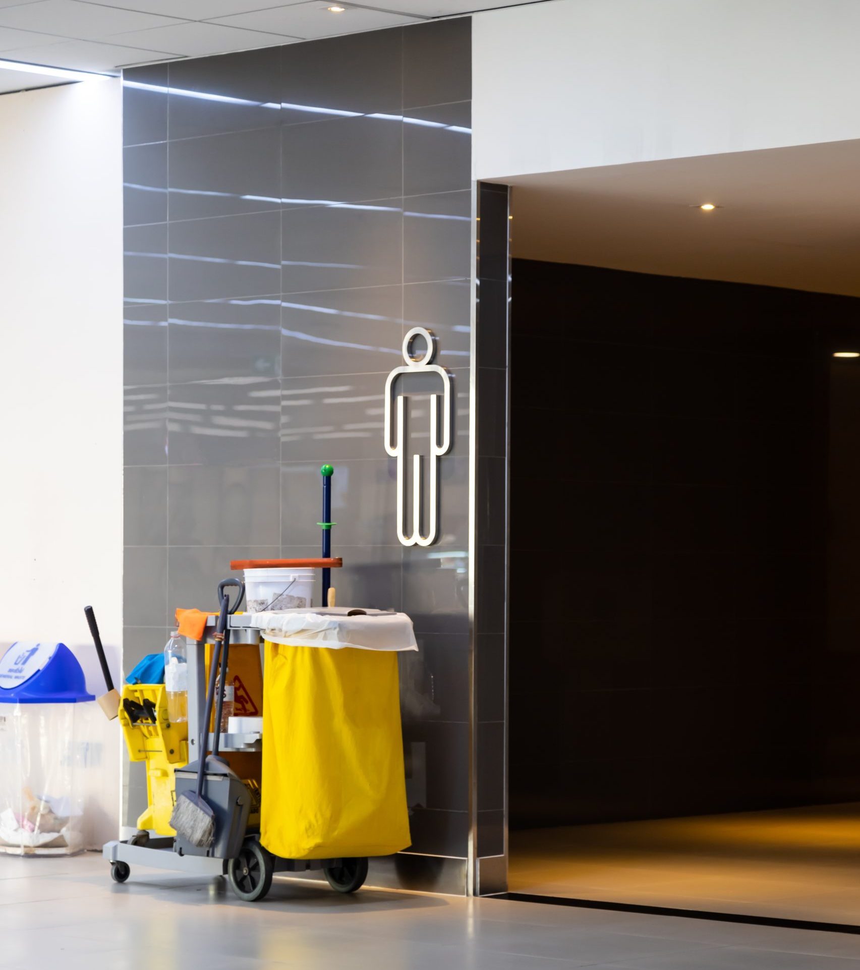 GettyImages 1311654404 scaled e1702280947490 Commercial 4 cleaning products outside of an office bathroom