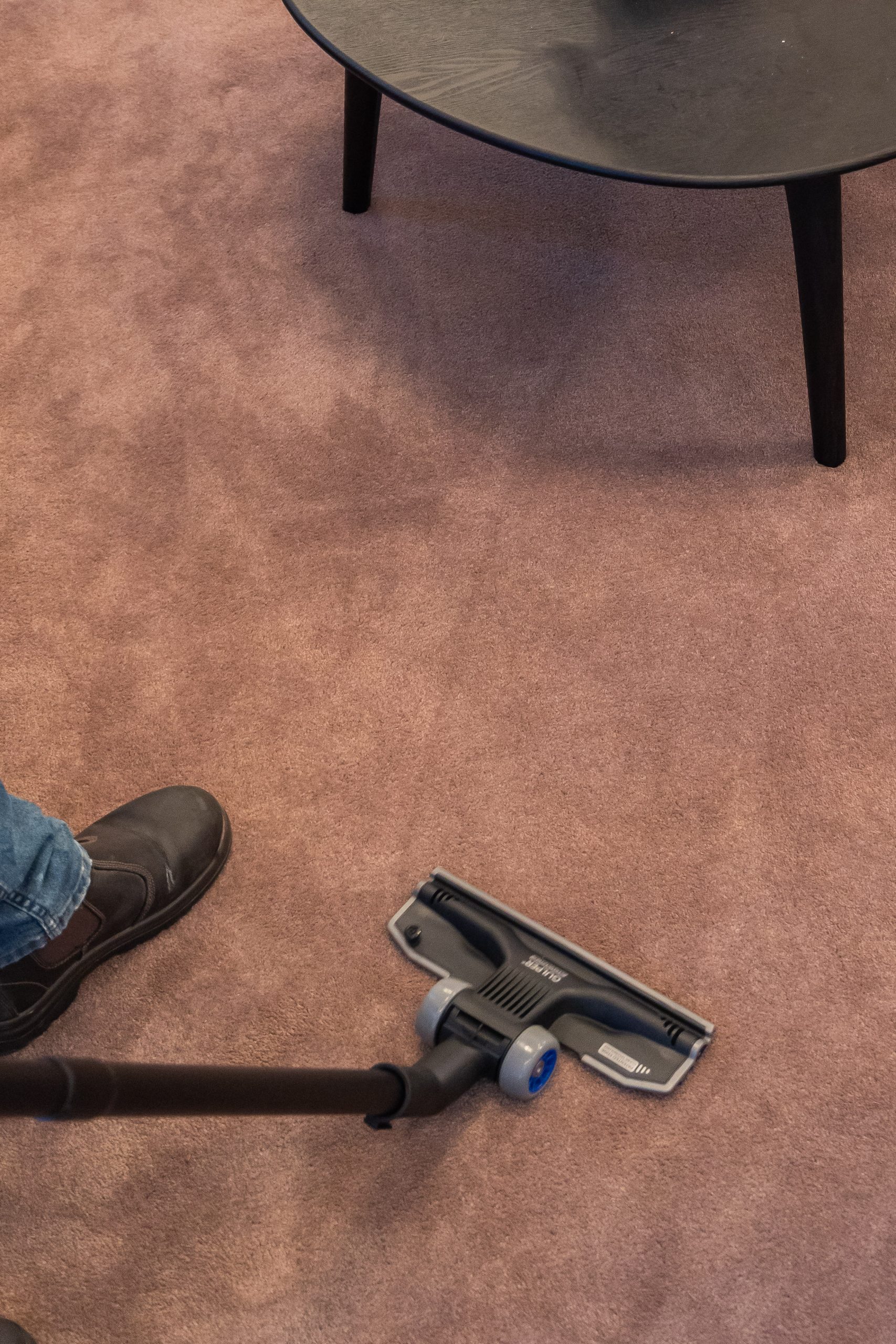 close up of a carpet being vacuumed