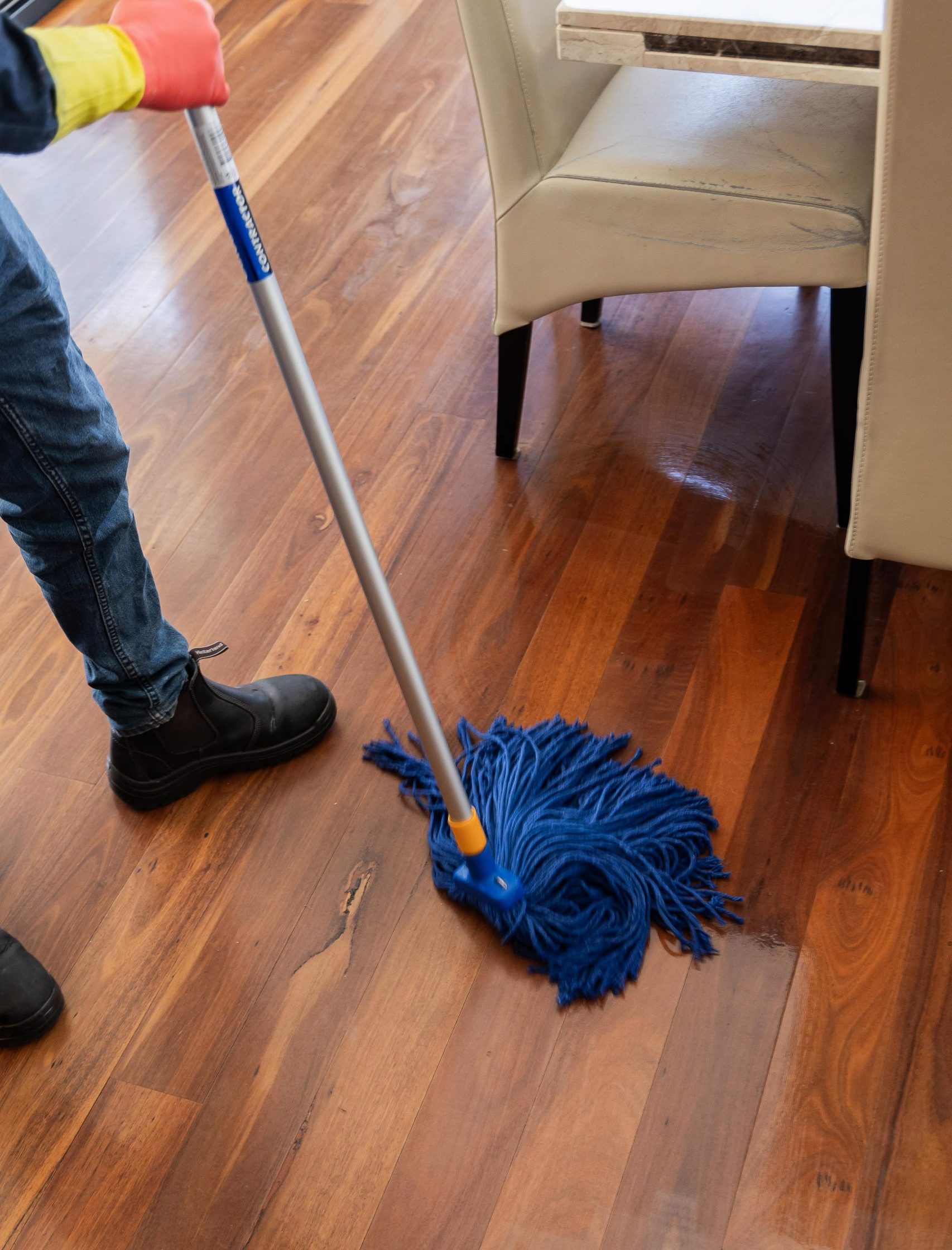 mop being used to mop a floor