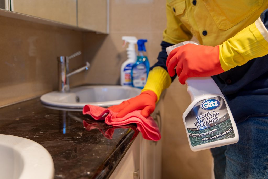 Perth cleaner scrubbing a laundry benchtop