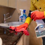 Perth cleaner scrubbing a laundry benchtop