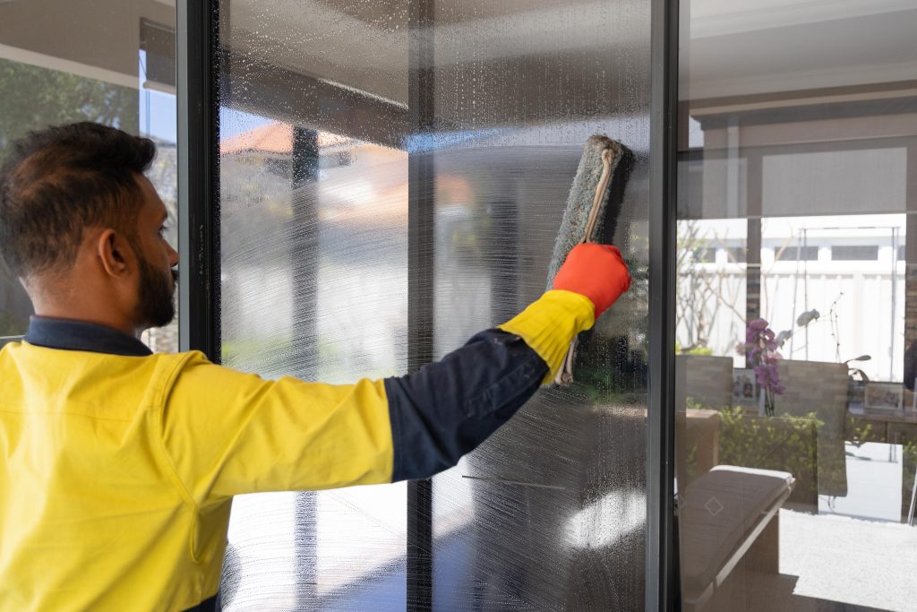 Perth residential cleaner cleaning a sliding door